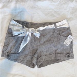 Gray shorts with white satin ribbon belt
